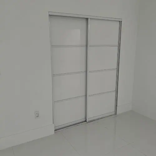 Tall white closet doors installed